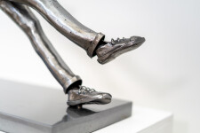 This figurative indoor sculpture of a male is hand forged in steel. Image 8