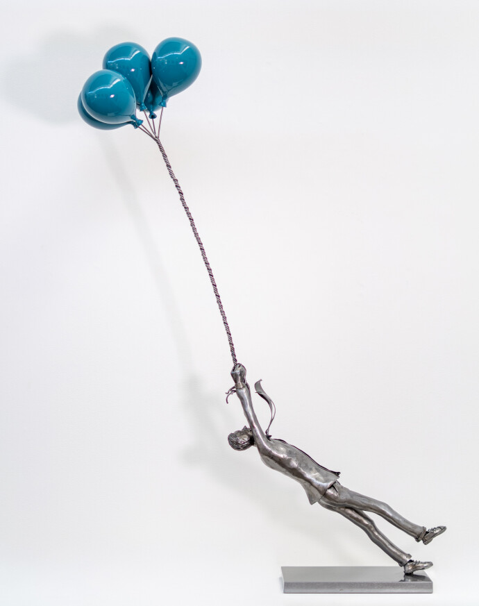 This figurative indoor sculpture of a male is hand forged in steel.