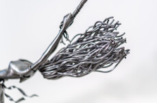 This contemporary figurative indoor sculpture of a female is hand forged from metal. Image 10