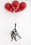 Rendered in fine detail, a steel rendering of horse blinders is carried upwards by glossy red balloons in this provocative sculpture by Dery… Image 2