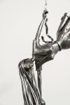 This figurative steel kinetic indoor sculpture challenges cultural norms about women. Image 8