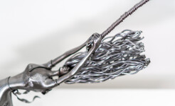 This contemporary figurative indoor sculpture of a female is hand forged from metal. Image 8