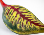 Australian glass artist Eileen Gordon’s leaf in jewel tones of red and forest green captures the lovely organic shape of a fallen leaf. Image 7