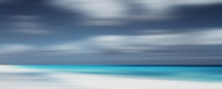 The blurring of time and space captured in time-lapse photography while the photographer is in motion has resulted in a lined pale beach, ce…