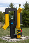 This contemporary abstract outdoor painted steel sculpture is figurative. Image 3
