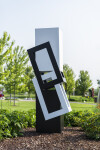This abstract sculpture, which can be installed indoors or outdoors, is painted in a striking black and white. Image 14