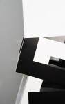 This abstract sculpture, which can also be installed outside, is painted in a striking black and white. Image 9