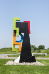 This contemporary abstract outdoor steel sculpture represents a male figure. Image 3