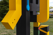 This contemporary abstract outdoor painted steel sculpture is figurative. Image 11