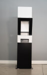 This abstract sculpture, which can also be installed outside, is painted in a striking black and white. Image 3