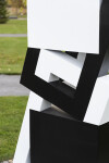 This abstract sculpture, which can be installed indoors or outdoors, is painted in a striking black and white. Image 11