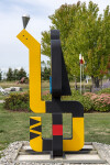 This contemporary abstract outdoor painted steel sculpture is figurative. Image 12