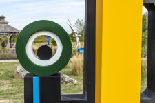 This contemporary abstract outdoor painted steel sculpture is figurative. Image 10