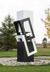 This abstract sculpture, which can be installed indoors or outdoors, is painted in a striking black and white. Image 6