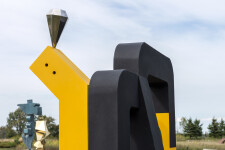 This contemporary abstract outdoor painted steel sculpture is figurative. Image 13