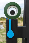 This contemporary abstract outdoor painted steel sculpture is figurative. Image 9