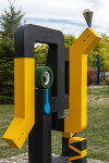 This contemporary abstract outdoor painted steel sculpture is figurative. Image 7