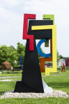 This contemporary abstract outdoor steel sculpture represents a male figure. Image 9