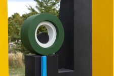 This contemporary abstract outdoor painted steel sculpture is figurative. Image 5
