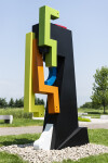 This contemporary abstract outdoor steel sculpture represents a male figure. Image 4