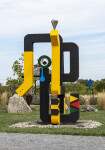 This contemporary abstract outdoor painted steel sculpture is figurative. Image 4