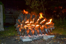 This contemporary outdoor steel sculpture of a pine cone by Floyd Elzinga is also wood-burning. Image 3
