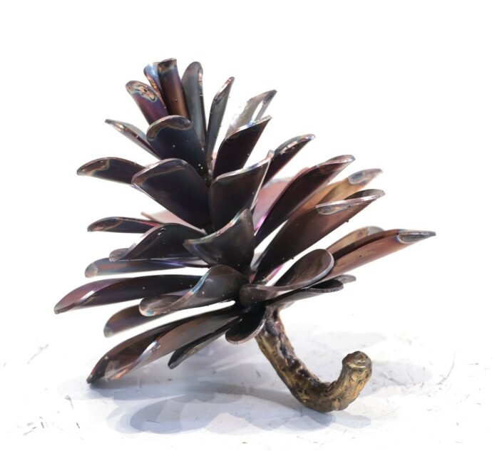 This contemporary table top metal sculpture of a pine cone is by Floyd Elzinga.