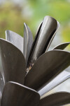 This contemporary outdoor sculpture of a pine cone is made from metal by Floyd Elzinga. Image 4