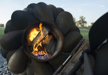 This contemporary outdoor steel sculpture of a pine cone by Floyd Elzinga is also wood-burning. Image 8