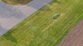 This contemporary outdoor monumental metal sculpture by Floyd Elzinga resembles a dandelion seed. Image 6