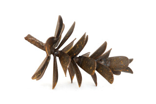 This contemporary table top steel sculpture of a pine cone is by Floyd Elzinga.