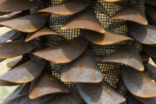 This contemporary outdoor sculpture of a pine cone made from steel is by Floyd Elzinga. Image 7