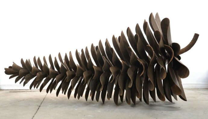 This contemporary large metal sculpture of a pine cone is by Floyd Elzinga.