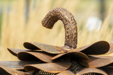 This contemporary outdoor sculpture of a pine cone made from steel is by Floyd Elzinga. Image 5