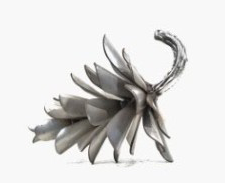 This contemporary table top metal sculpture of a pine cone is by Floyd Elzinga.