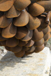 Hand forged from weathering steel Floyd Elzinga’s impressive outdoor sculpture of a pine cone is designed to house logs for a fire. Image 9