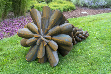 This contemporary outdoor sculpture was forged from steel; its form is inspired by nature. Image 3