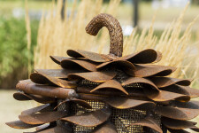 This contemporary outdoor sculpture of a pine cone made from steel is by Floyd Elzinga. Image 6
