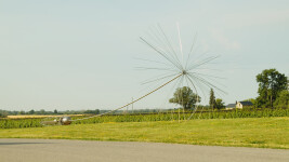 This contemporary outdoor monumental metal sculpture by Floyd Elzinga resembles a dandelion seed. Image 2