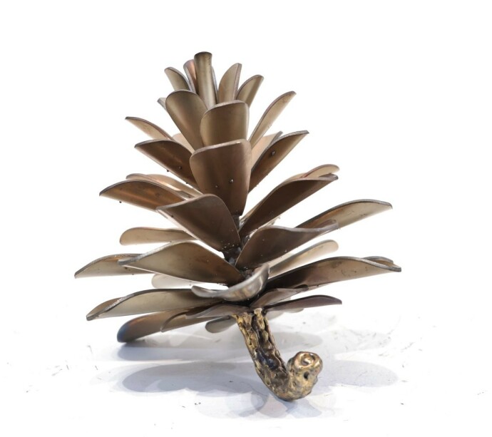 This contemporary table top metal sculpture of a pine cone is by Floyd Elzinga.