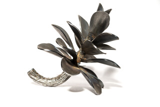 This elegant contemporary small tabletop sculpture is by Floyd Elzinga.