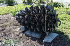 This contemporary outdoor steel sculpture of a pine cone by Floyd Elzinga is also wood-burning. Image 13