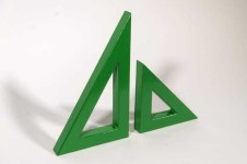 Two striking triangles in bright apple green steel; their center cut-out triangles stand beside one another in this new tabletop sculpture b… Image 3