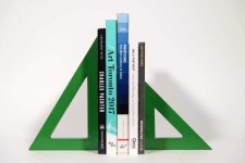 Two striking triangles in bright apple green steel; their center cut-out triangles stand beside one another in this new tabletop sculpture b… Image 6