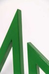 Two striking triangles in bright apple green steel; their center cut-out triangles stand beside one another in this new tabletop sculpture b… Image 5