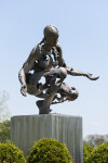 This sculpture portrays a woman gazing towards earth beneath her, crafted with a reconstructive approach. Image 7