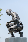 This sculpture portrays a woman gazing towards earth beneath her, crafted with a reconstructive approach. Image 4