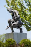 This figurative bronze and stainless steel outdoor sculpture of a female was created by a Canadian artist. Image 3