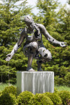 This sculpture portrays a woman gazing towards earth beneath her, crafted with a reconstructive approach. Image 2