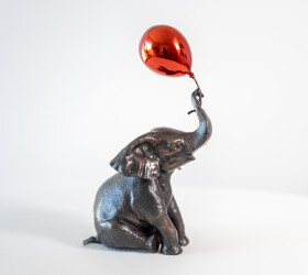 This contemporary bronze figurative tabletop sculpture of an elephant is by Gillie and Marc.